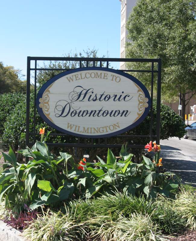 Welcome to Historic Downtown Wilmington sign with landscaping