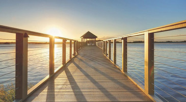 Lake dock at sunset in the RiverLights community