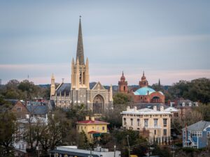 Skyline view of downtown Wilmington, NC showing the spire of St. Mary Catholic Church and historic Market Street mansions