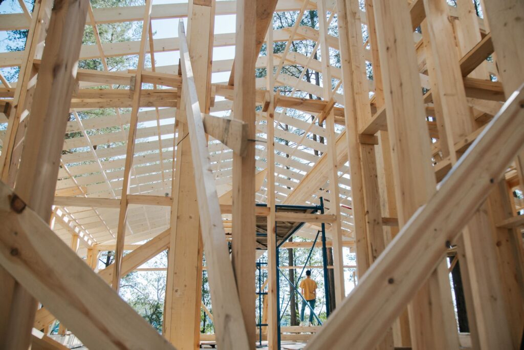 Wood framing of a new single-family home under construction, viewed from inside the first floor