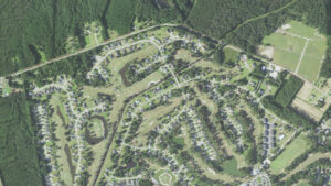 Aerial view of golf holes, ponds and single-family homes along North Middleton Drive NW in Brunswick Plantation, Calabash, North Carolina