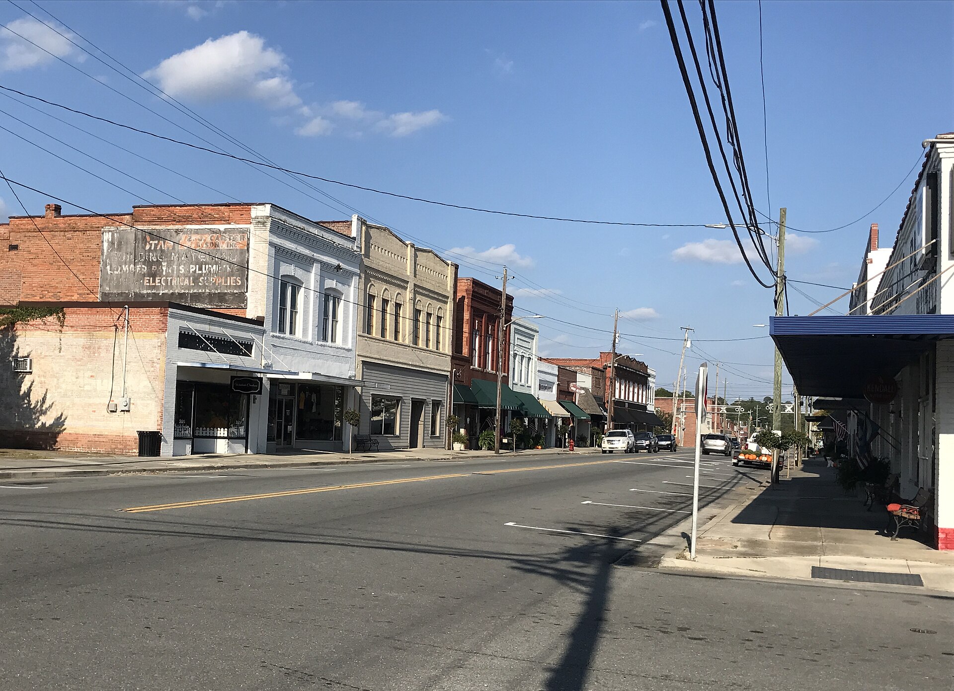 Storefronts and awnings along the main commercial street in downtown Wallace, North Carolina