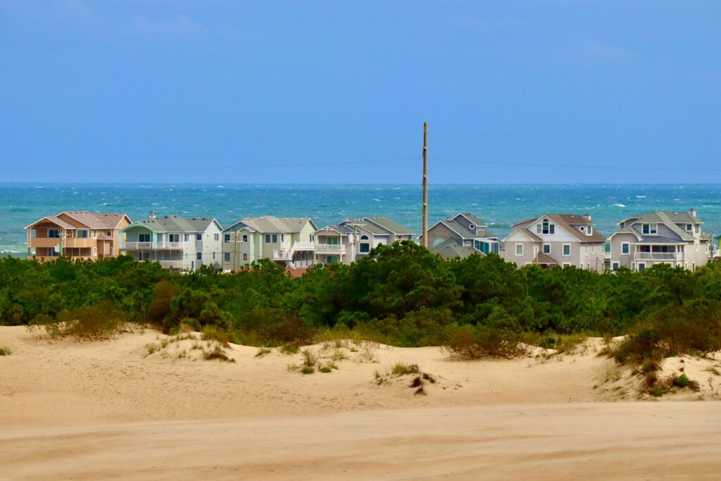 A row of elevated beach houses behind the dunes on the North Carolina coast